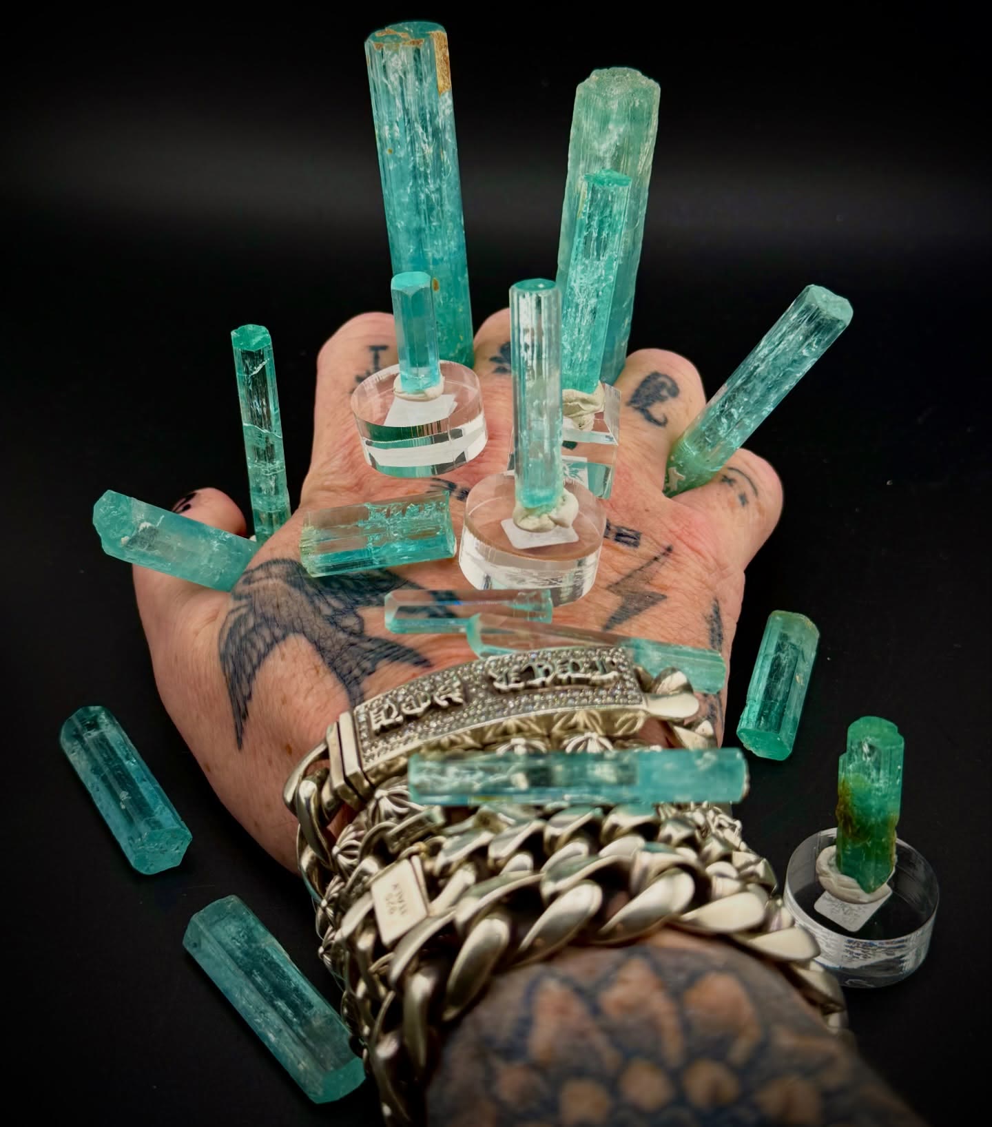 Hand covered in emerald fire