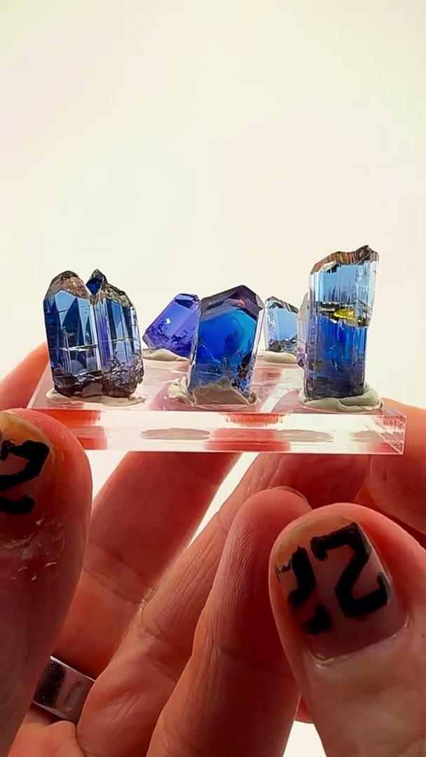8 absolute Tanzanite heaters lined up like a hall of fame roster
